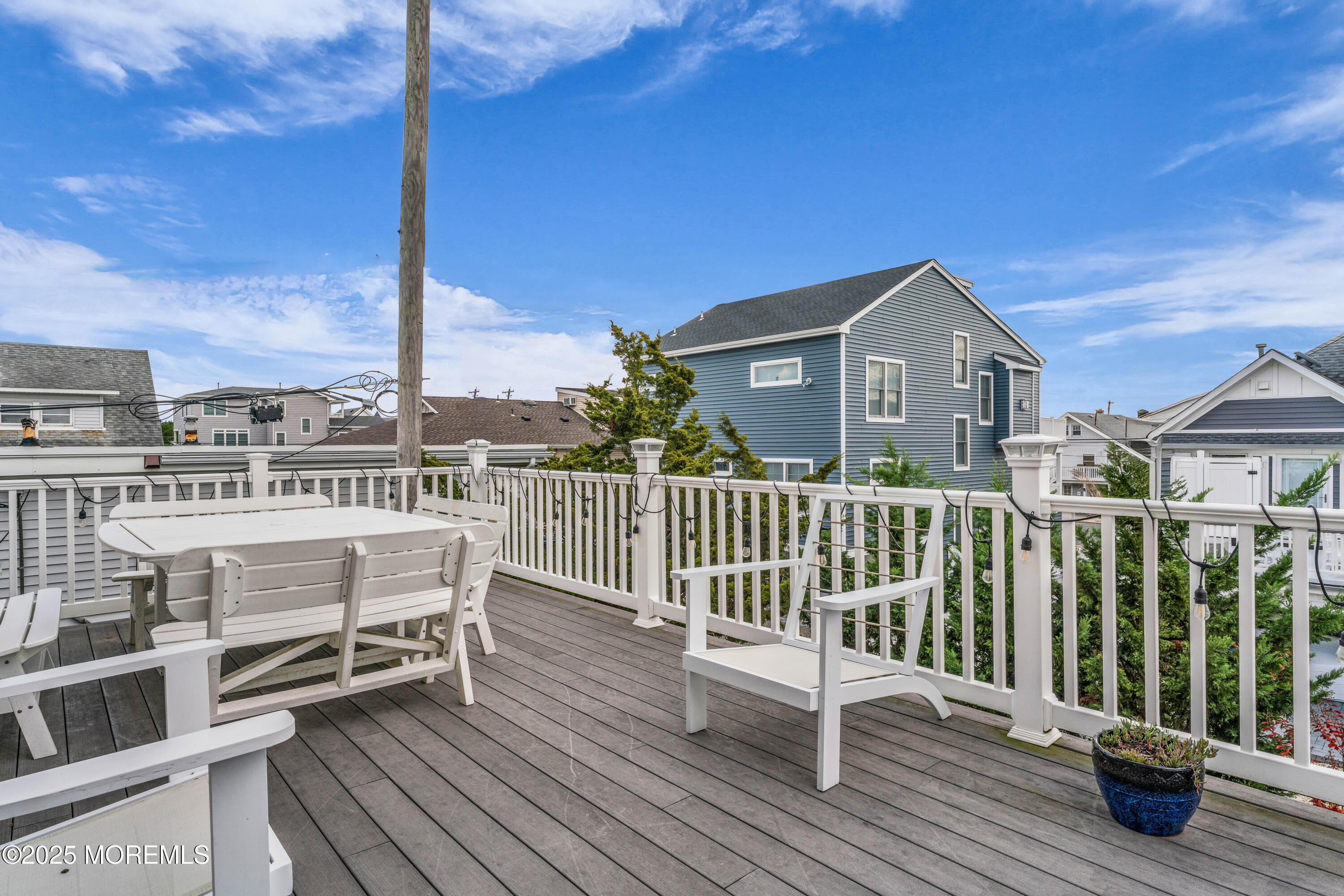 111 7th Avenue Seaside Park, NJ 08752 - Photo 40 of 46 a view of a chairs on deck with wooden floor