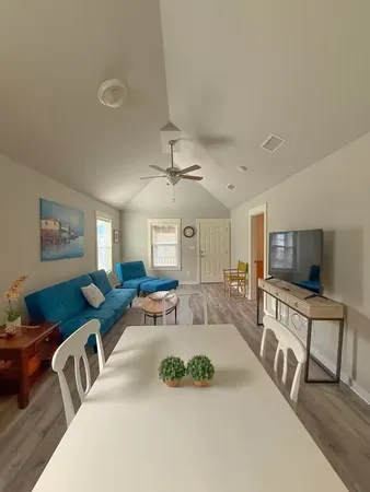 a living room with furniture and a flat screen tv