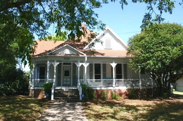 a front view of a house with porch