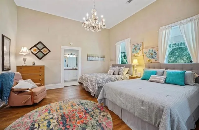 a bedroom with bed and window