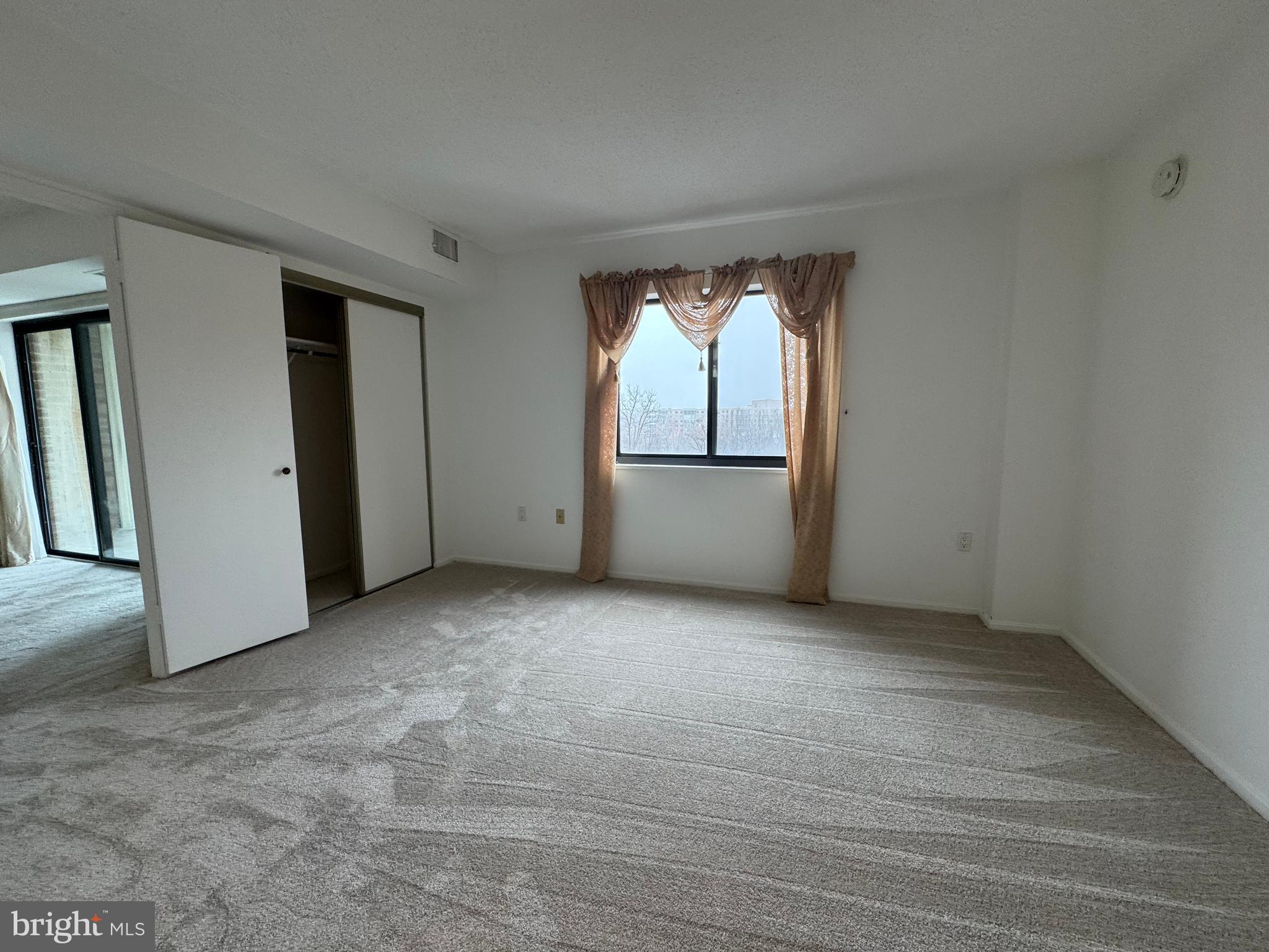15115 Interlachen Drive, Unit 3815 Silver Spring, MD 20906 - Photo 13 of 22 an empty room with windows