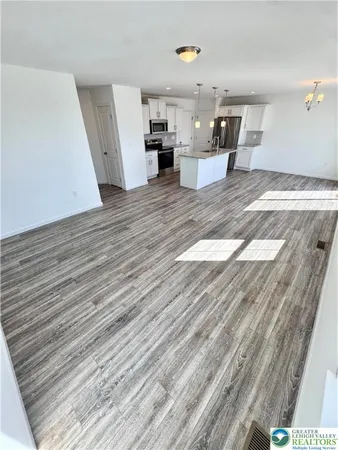 a view of a kitchen and dining room