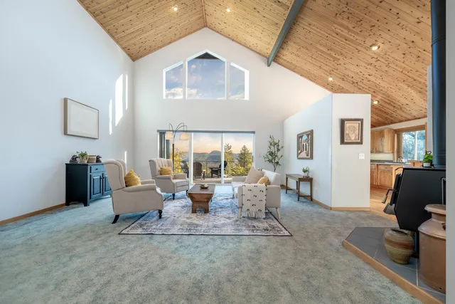 a view of a dining room with furniture wooden floor and chandelier