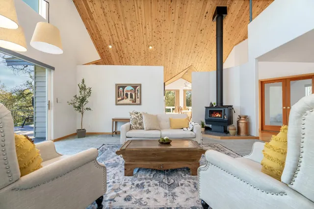 a kitchen with a sink window and cabinets