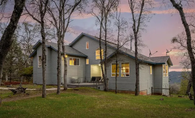 aerial view of a house with a yard
