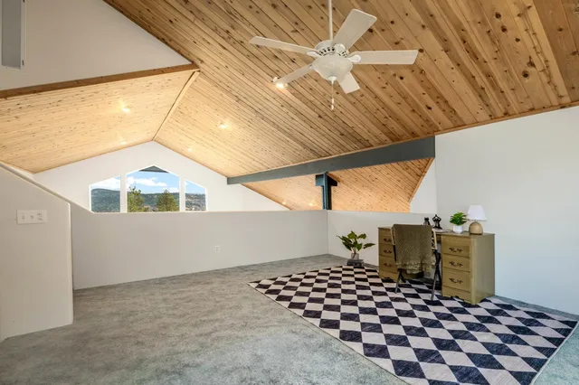 a view of a big yard with large trees