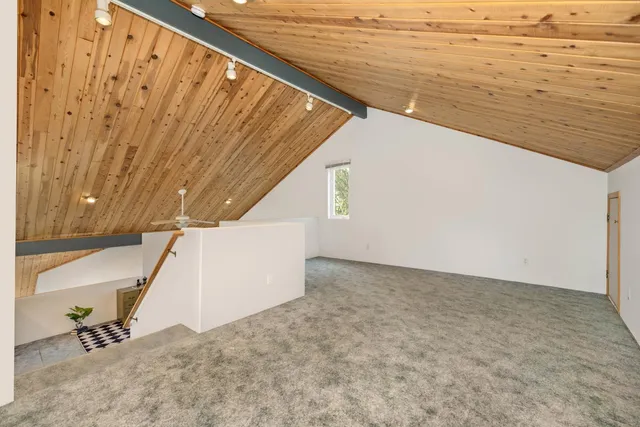 a view of a yard with a house and a tree