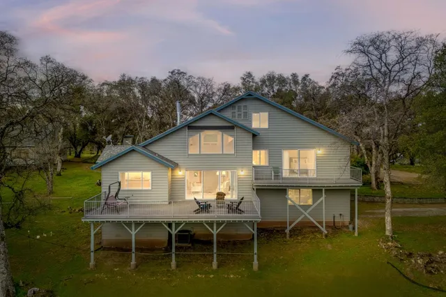 a house with a trees in front of it