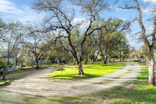 a view of a house with a chairs in patio
