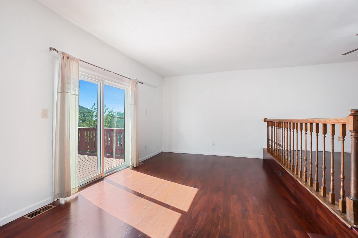 35 Bellfalls Way Nottingham, MD 21236 - Photo 11 of 30 a view of a room with wooden floor and iron gate