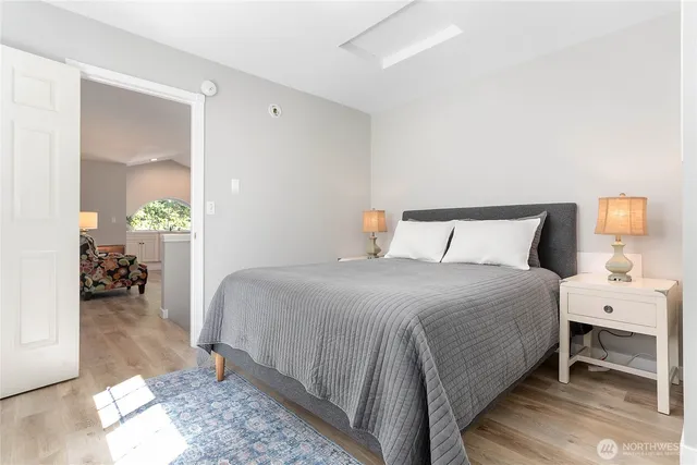 a bedroom with a bed and a table