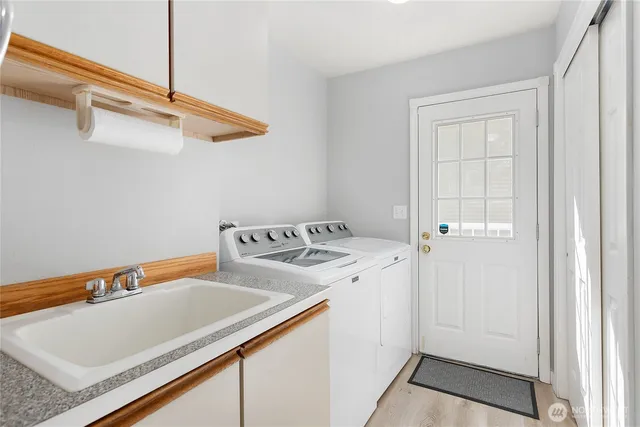 a utility room with dryer and washer