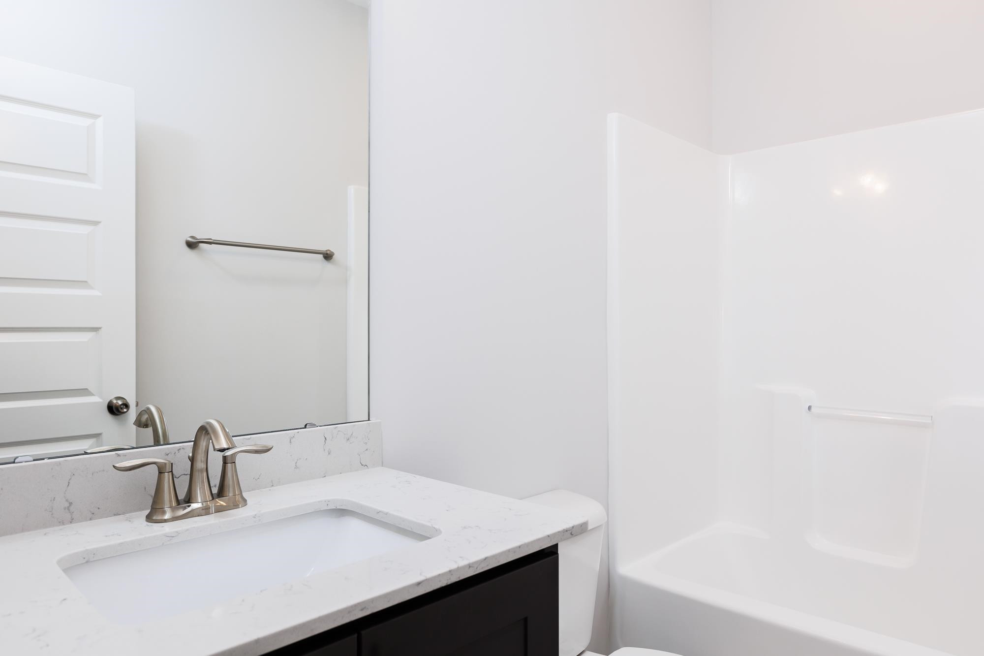 8232 Ebenezer Church Road Raleigh, NC 27613 - Photo 25 of 33 This photo is representative of the same floor plan. Second Bath