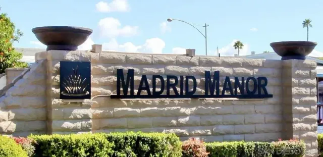 a bedroom with a bed and ceiling fan