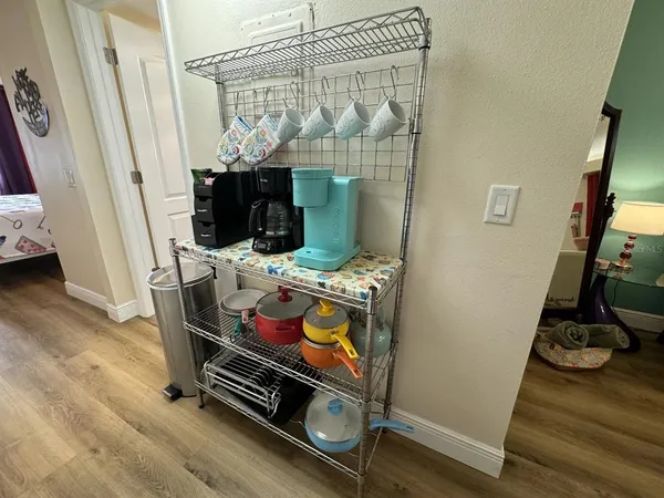 a bedroom with a bed and a mirror