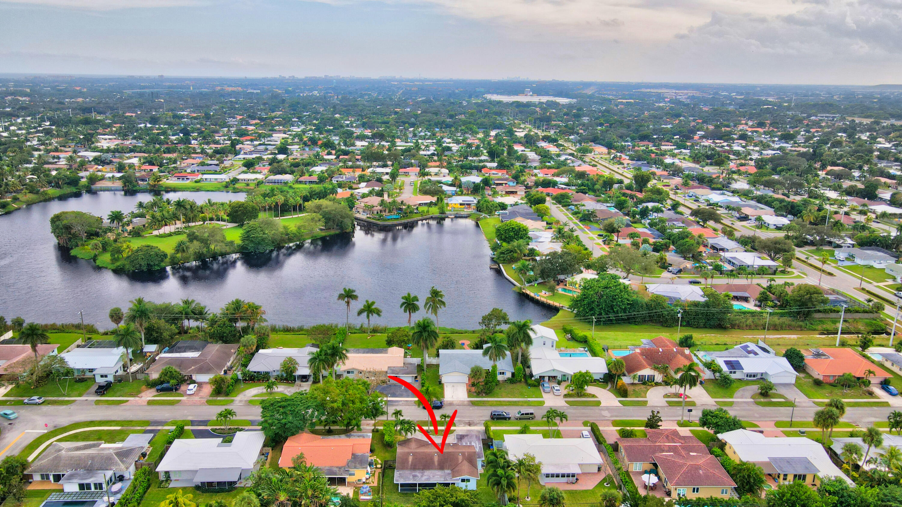 1133 Southwest 7th Street Boca Raton, FL 33486 - Photo 20 of 20 an aerial view of a houses with a lake view