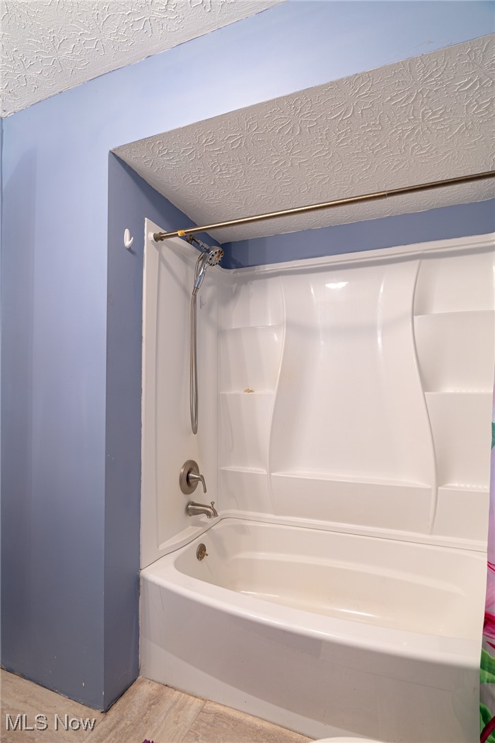 6747 Giddings Road Rootstown, OH 44272 - Photo 20 of 39 Hallway bathroom with shower enclosure