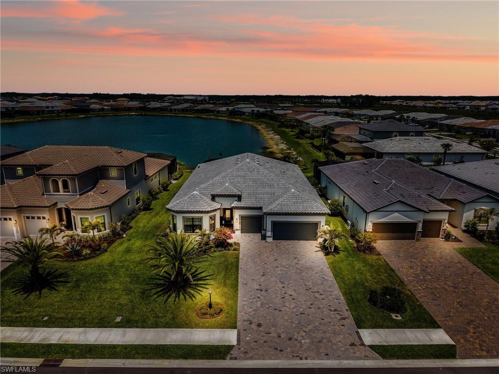 18412 Ridgeline Drive Estero, FL 33928 - Photo 3 of 50 an aerial view of a house with garden space and street view