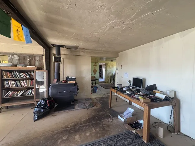 a room with furniture a air conditioner and a window