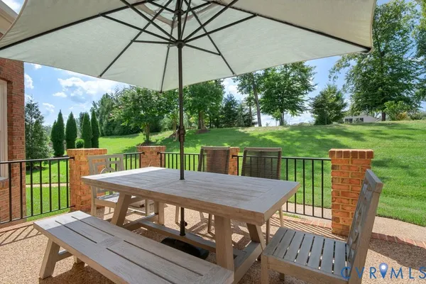 a view of a deck with furniture