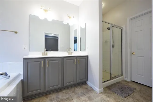 a bathroom with a double vanity sink mirror and double