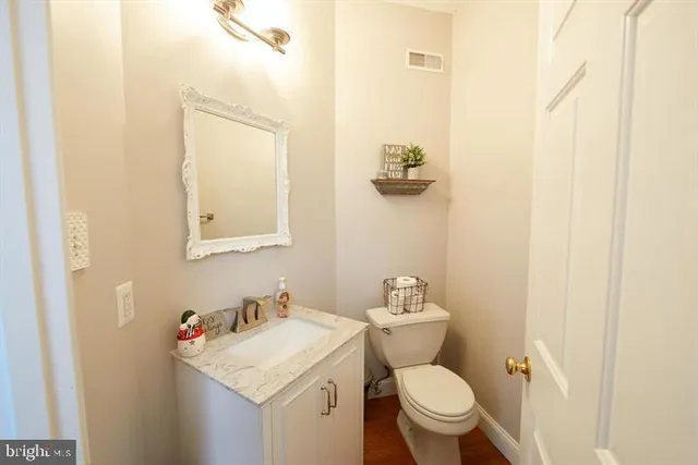 a view of entryway with a window and wooden floor