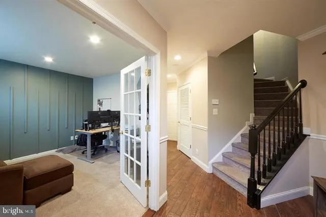 a livingroom with workspace and a window