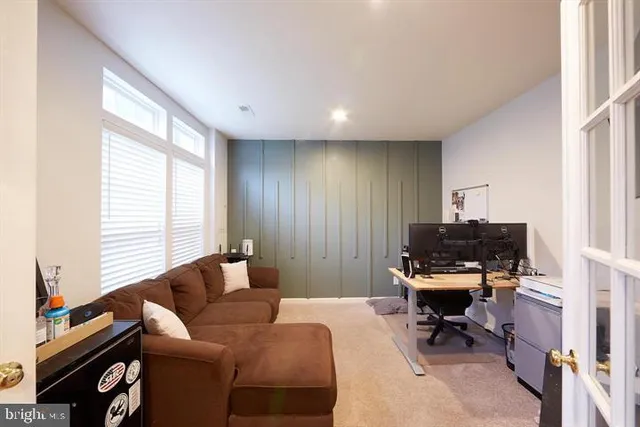 a view of a livingroom with furniture and hardwood floor