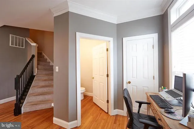 a view of a balcony with floor to ceiling window and wooden floor