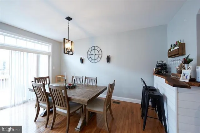 a view of a dining room with furniture and window