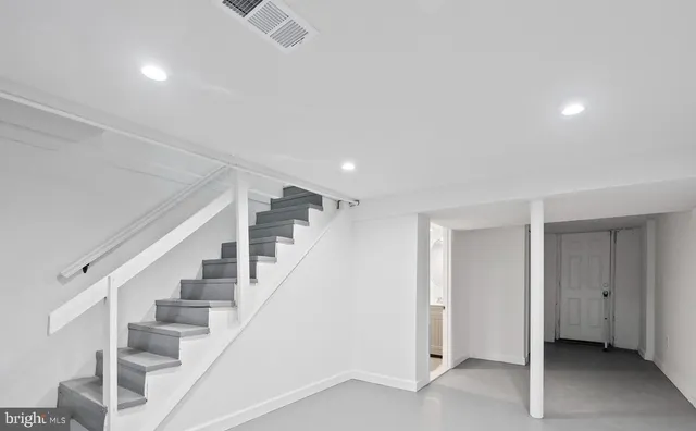 a view of entryway with stairs and wooden floor