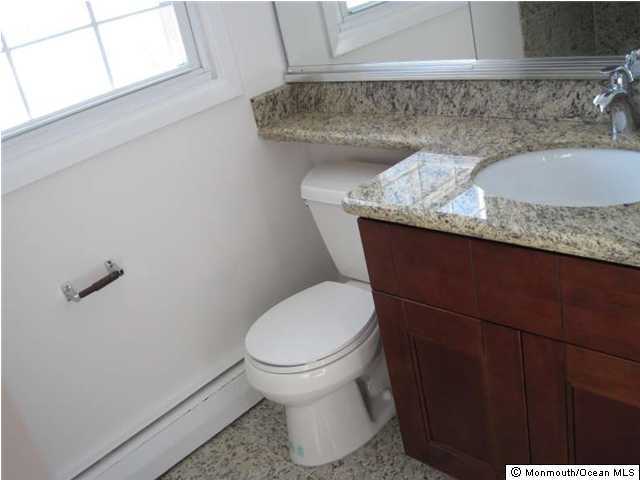 178 Van Brackle Road Matawan, NJ 07747 - Photo 3 of 3 a bathroom with a granite countertop toilet sink and mirror