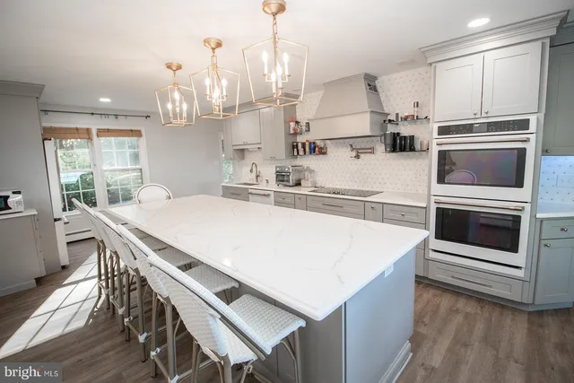 a en suite bathroom with a sink a mirror and a toilet