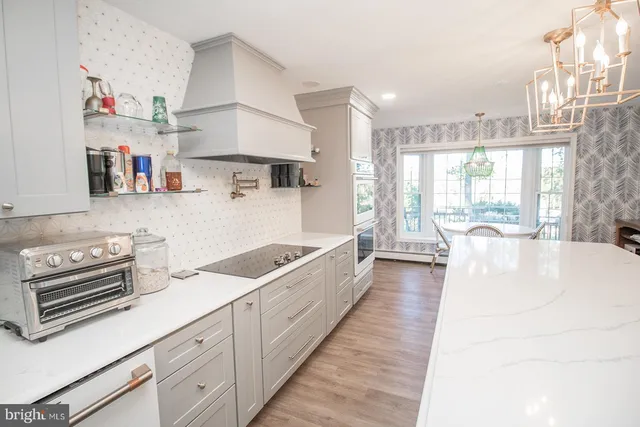 a view of walk in closet with clothes