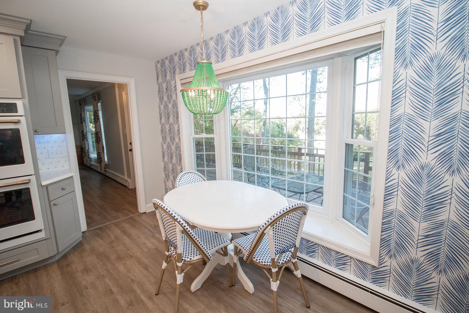8120 Chapel Point Road Port Tobacco, MD 20677 - Photo 24 of 95 a view of a dining room with furniture window and wooden floor