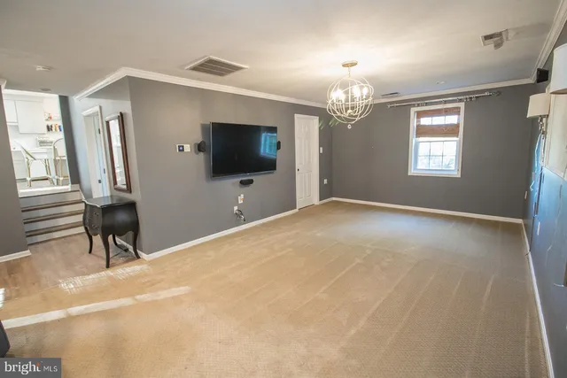 a view of wooden floor and windows in a room