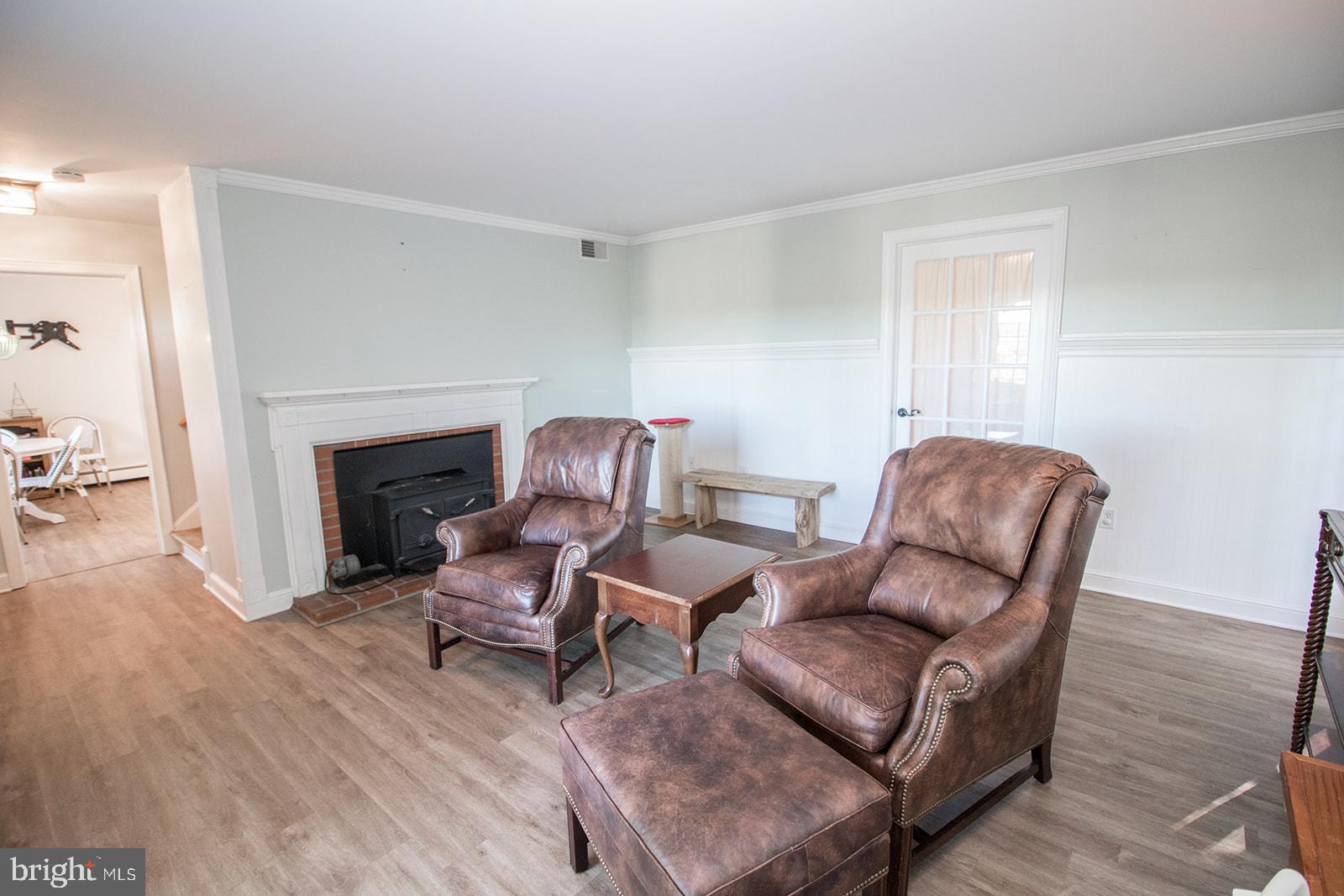 8120 Chapel Point Road Port Tobacco, MD 20677 - Photo 3 of 95 a living room with furniture and a fireplace