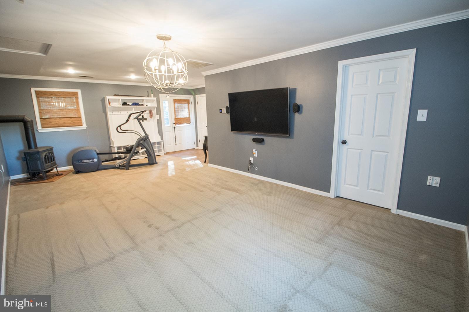 8120 Chapel Point Road Port Tobacco, MD 20677 - Photo 32 of 95 a view of a livingroom with furniture and a flat screen tv