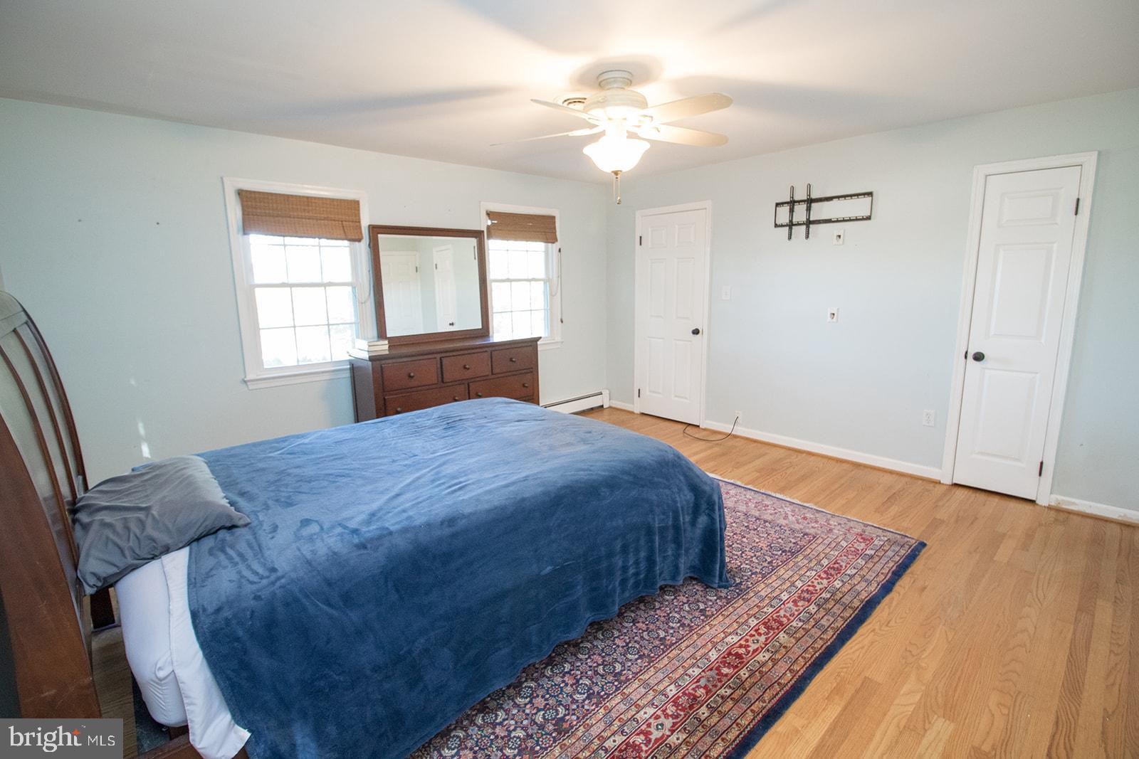 8120 Chapel Point Road Port Tobacco, MD 20677 - Photo 41 of 95 a bedroom with a bed dresser and a window