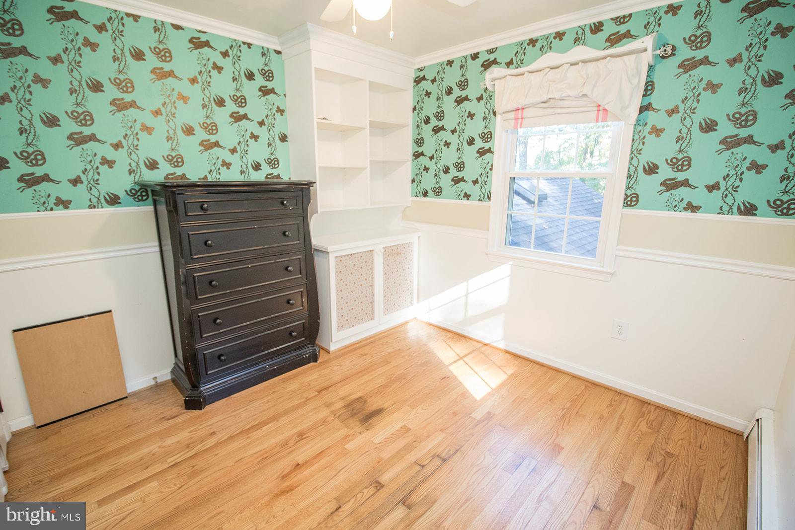 8120 Chapel Point Road Port Tobacco, MD 20677 - Photo 51 of 95 a view of wooden floor and windows in a room