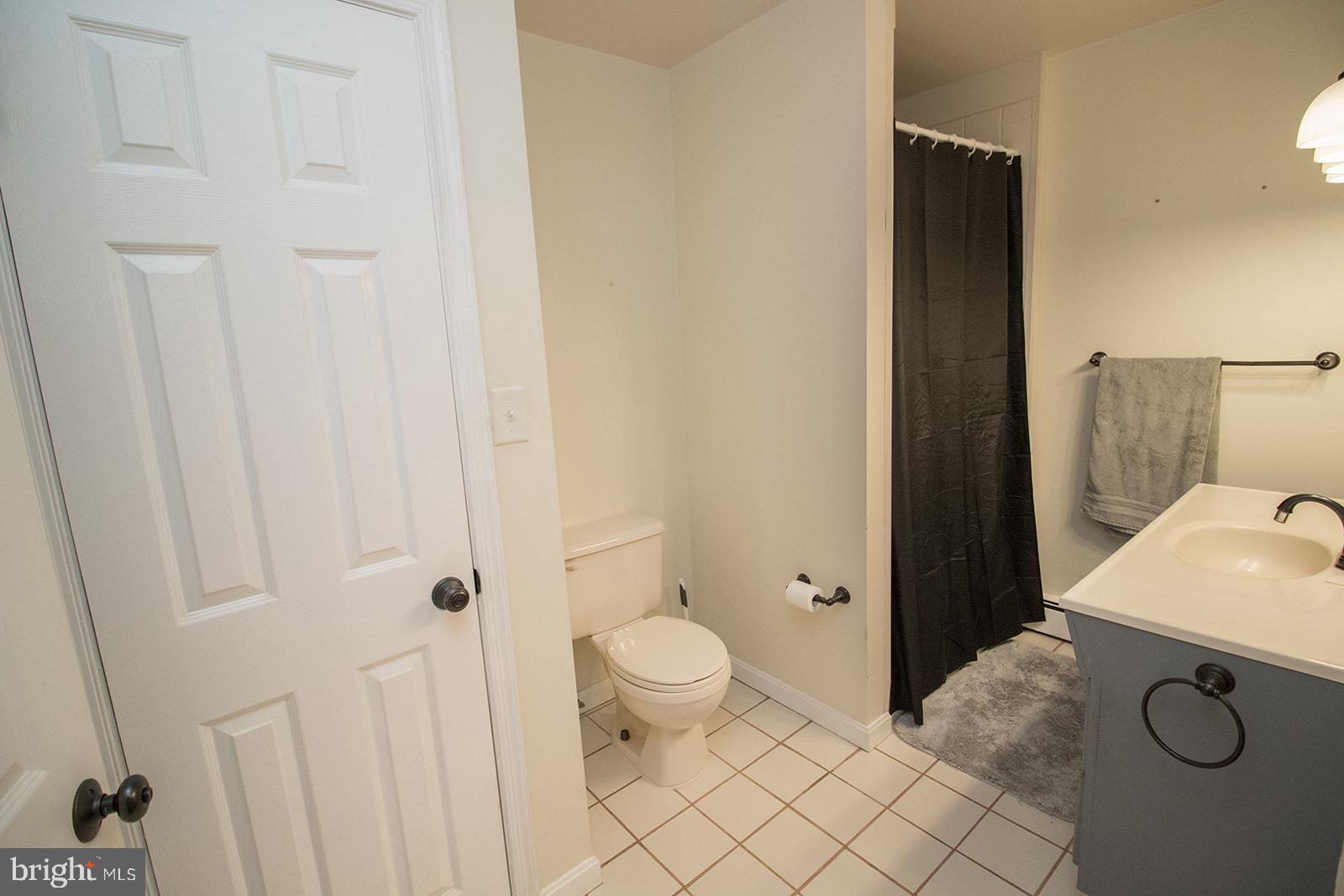 8120 Chapel Point Road Port Tobacco, MD 20677 - Photo 57 of 95 a bathroom with a granite countertop sink and a mirror