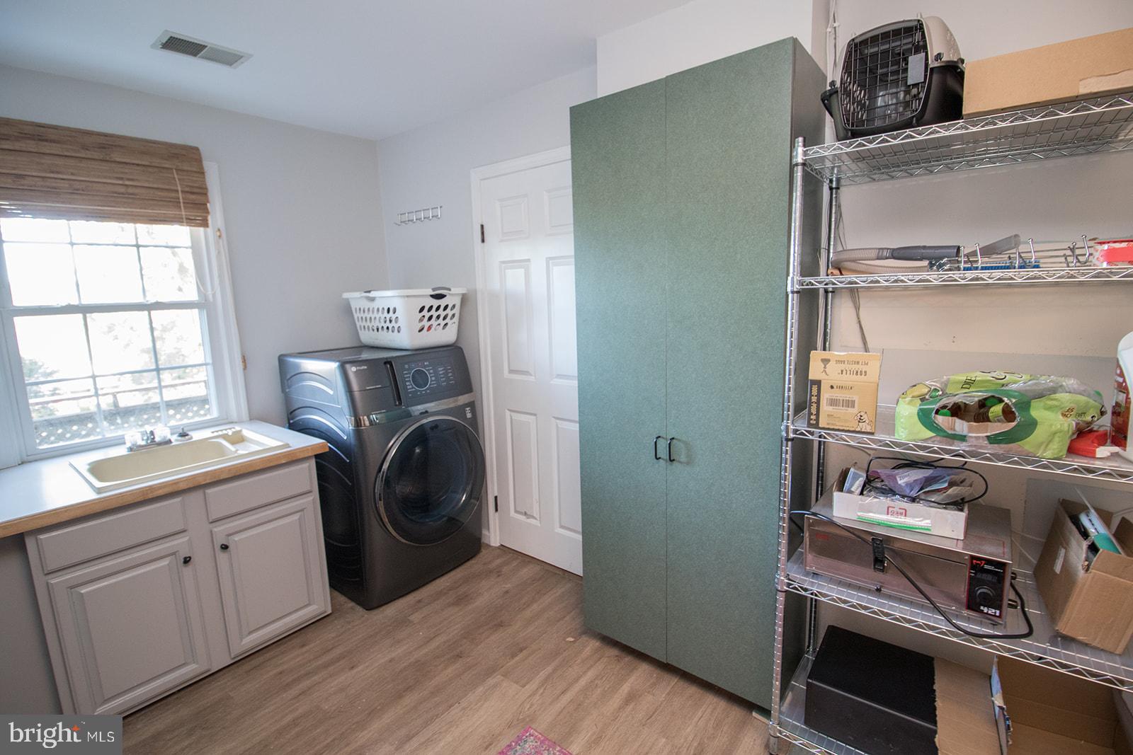 8120 Chapel Point Road Port Tobacco, MD 20677 - Photo 59 of 95 a utility room with sink dryer and washer