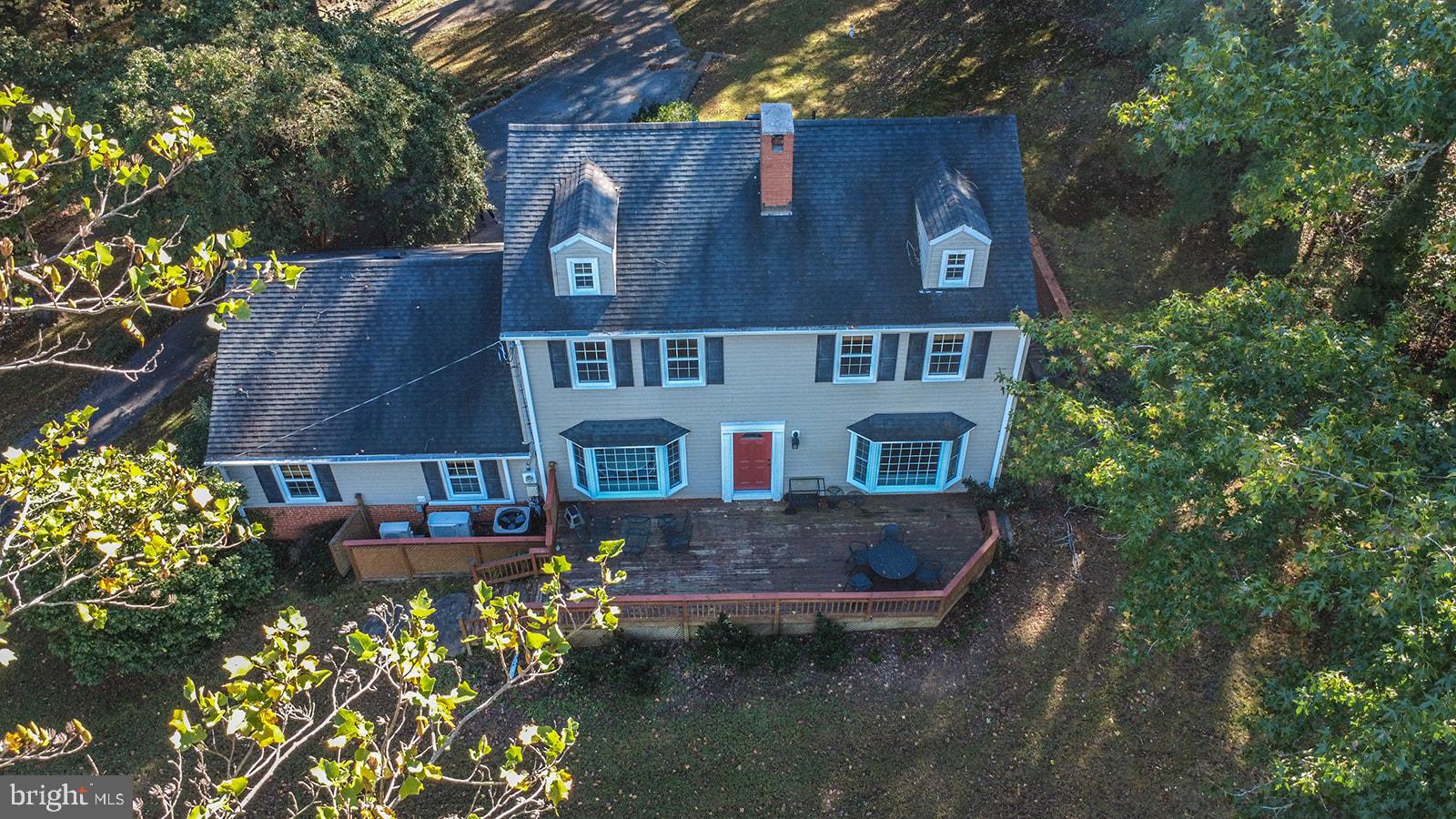 8120 Chapel Point Road Port Tobacco, MD 20677 - Photo 66 of 95 an aerial view of a house with a yard and a large tree