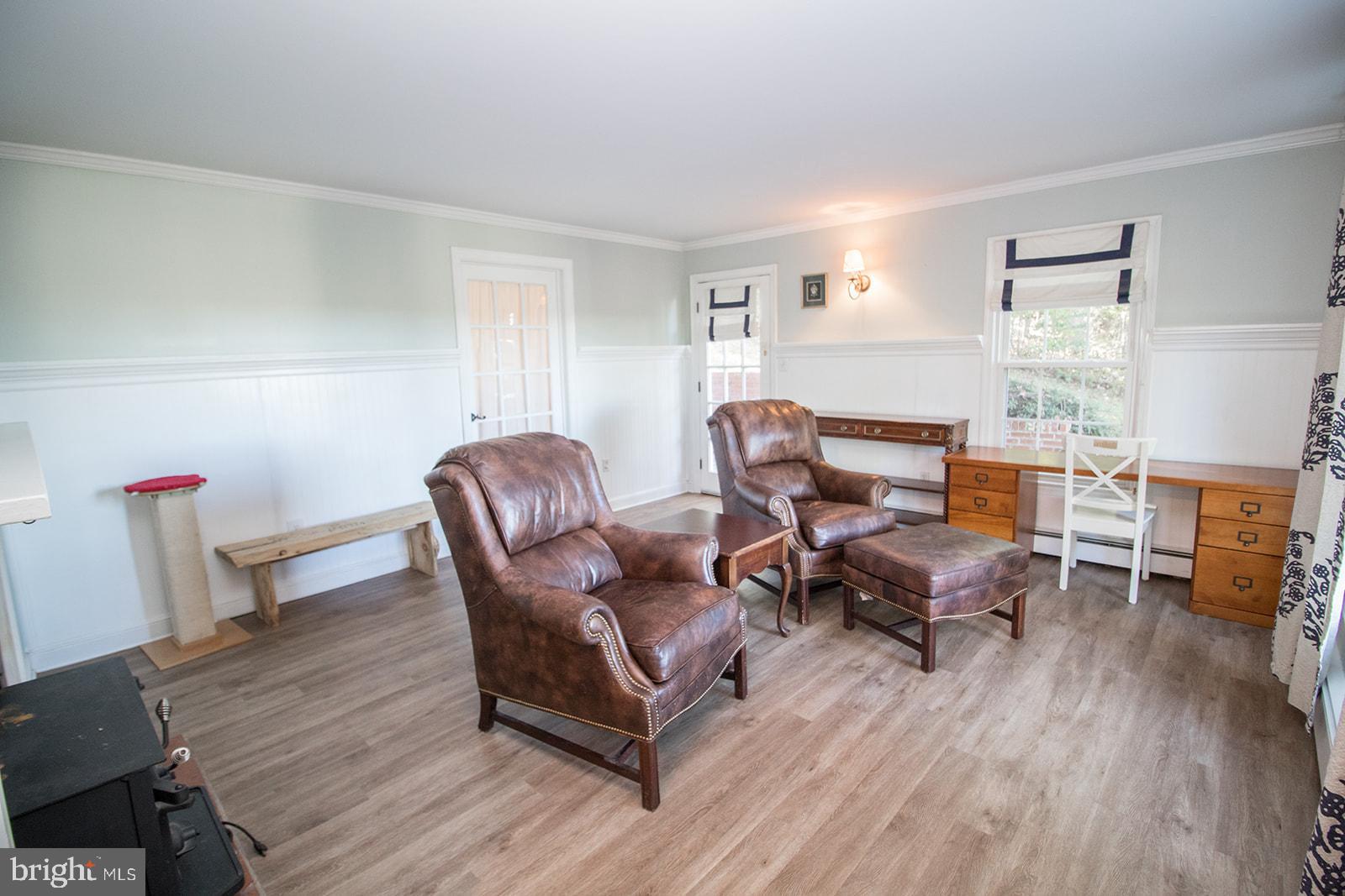 8120 Chapel Point Road Port Tobacco, MD 20677 - Photo 8 of 95 a living room with furniture and a wooden floor
