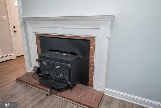 a kitchen with a stove oven and white cabinets