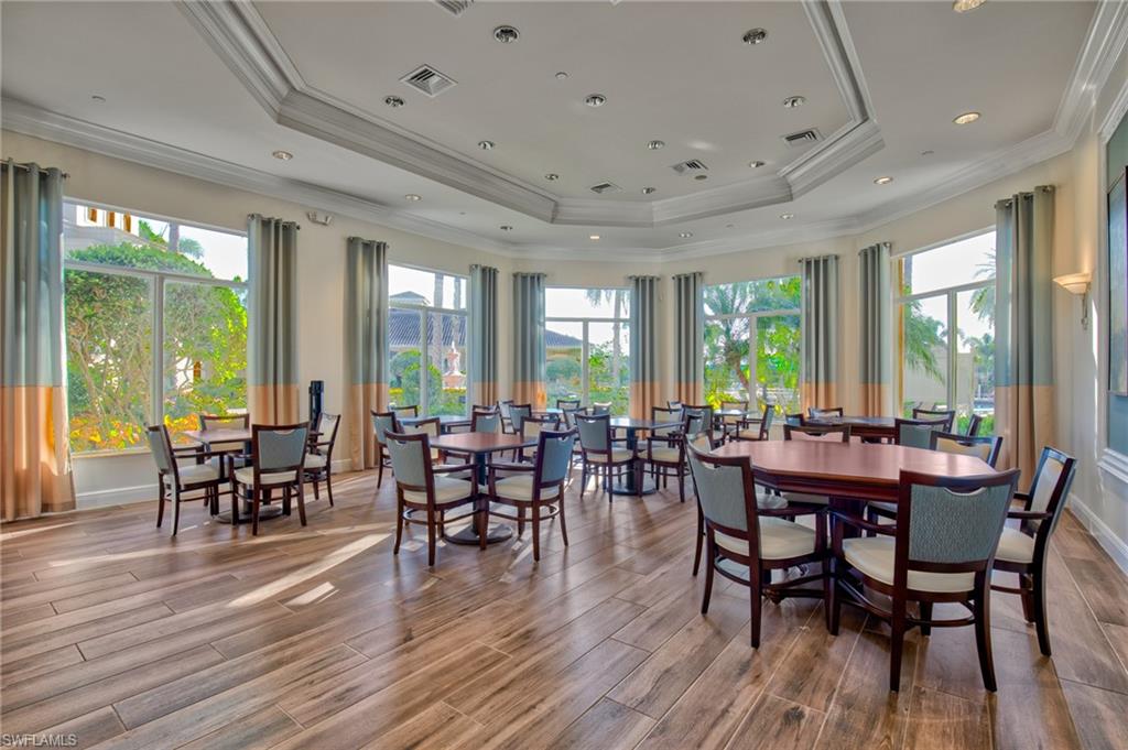 1767 Ribbon Fan Lane Naples, FL 34119 - Photo 26 of 31 Dining area with a raised ceiling and ornamental molding