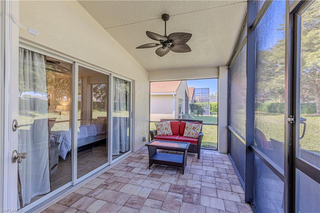 1767 Ribbon Fan Lane Naples, FL 34119 - Photo 3 of 31 Sunroom featuring vaulted ceiling and ceiling fan