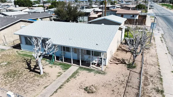 a view of a house with a snow in a yard