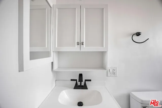 a bathroom with a sink and mirror