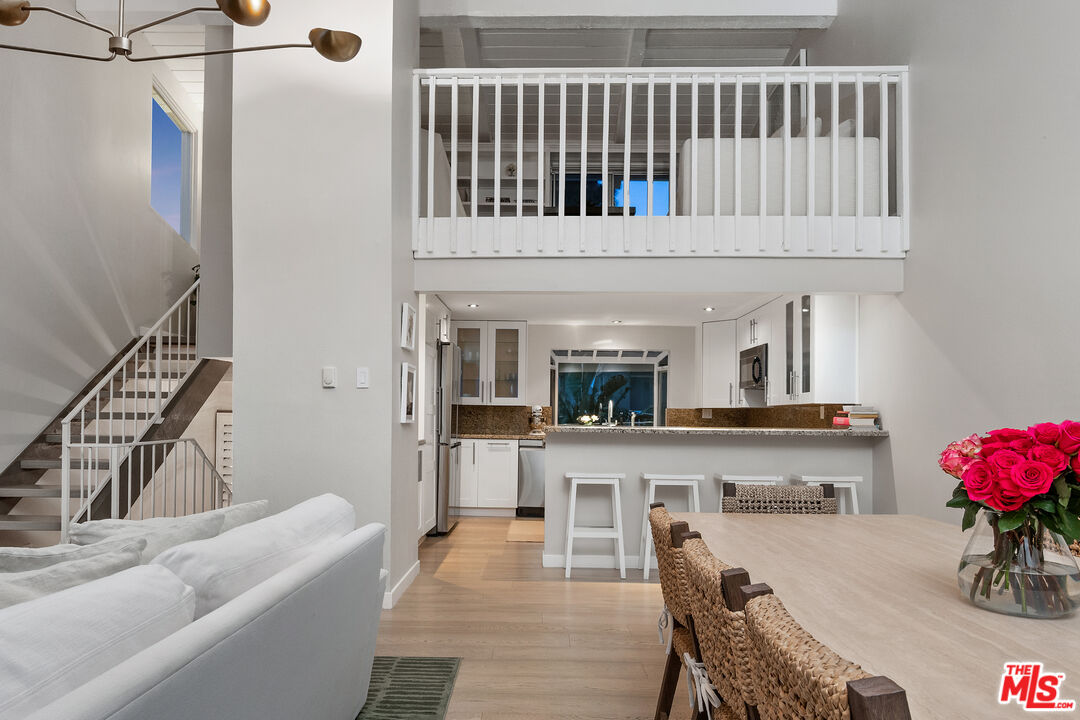 28378 Rey De Copas Lane Malibu, CA 90265 - Photo 12 of 45 a dining room with furniture and wooden floor